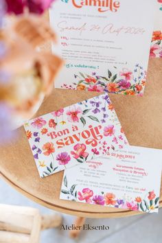 wedding stationery with flowers on the table