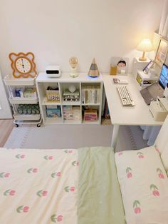 a bedroom with a bed, desk and computer