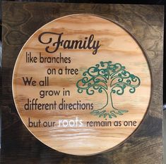 a wooden plaque that says family like branches on a tree we all grow in different directions but our roots remain as one