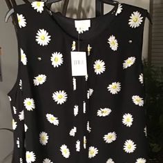 Nwt Authentic Kate Spade Daisy Dot Print Silk-Blend Sleeveless Black Blouse. Print Features Whimsical Daisies & Bumblebees On A Black Background. Crisp Pleated Center; Crewneck With Front Hook/Eye Closure. Cute Curved Hem. Quality Made Silk & Viscose Material Brand New With Tag No Damages Nor Stains Review All Pics/Video Before Purchase Approx Measurements: Armpit To Armpit 21” & 25.5”L Questions Are Welcome Before Purchase Polka Dot Sleeveless Blouse For Spring, Sleeveless Polka Dot Blouse For Spring, White Short Sleeve Top With Daisy Print, Black Sleeveless Blouse With Floral Print, Black Floral Embroidery Button-up Blouse, Black Cotton Dog Print Top, Kate Spade Black Knee-length Dress, Ruffle Hem Blouse, Heart Blouse