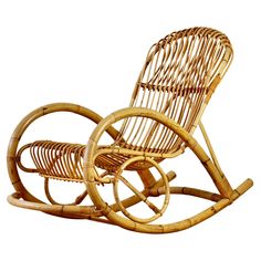 an old fashioned rocking chair made out of wood and wicker, with no wheels