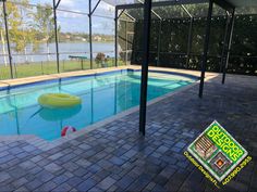 an empty swimming pool with a yellow floatie in the middle and some water around it