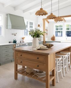 a kitchen with an island in the middle of it