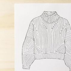 a drawing of a sweater on top of a piece of paper