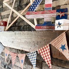 an american flag banner hanging on a brick wall