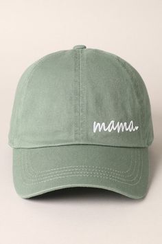 a green baseball cap with the word mama written on it in white embroidery across the front