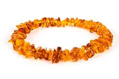 PRICES MAY VARY. 100% Made Of Natural Baltic Amber. You will get a certificate of Authenticity with each bracelet; Bracelets fits for Women and Men. Suitable for both the daily modern clothing and linen clothes. Made on elastic band which enables to increase size of this bracelet. High Quality and Genuine Baltic Amber ; Condition: Brand New; Shape of the bead: chips ;This bracelet is made from natural, very little polished Baltic amber ; Color: Honey; Cognac; Rainbow; Multi; Length: 7 - 7.9inch Baltic Amber Jewelry, Modern Clothing, Ancient Tree, Male Hands, Amber Bracelet, Amber Beads, Amber Jewelry, Amber Color, Modern Outfits