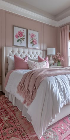 a bed with pink and white decor in a bedroom