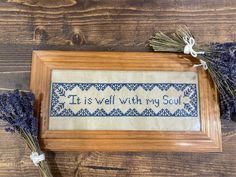 a cross stitch pattern with the words it is well with my soul in blue and white