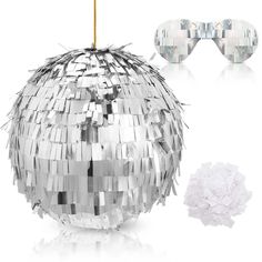 a disco ball with sunglasses on it next to a pair of eyeglasses that have been made out of tinsel