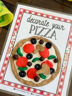 a homemade pizza is displayed on a card with the words decorate your pizza written above it