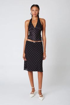 Calling all lovers of chic and effortless style! The Iris Top in Black by Nia The Label is a versatile must-have for your wardrobe.This top features a timeless design with a touch of modern flair, making it perfect for various occasions. A classic... Polka Dot Skirt, Dot Skirt, Slip Skirt, Black Midi Skirt, Black Midi, Long Sleeve Shirt Dress, Knee Length Skirt, Sophisticated Style