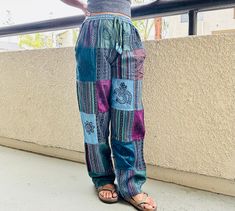 Get in the boho spirit this year with these boho hippie pant from Kathmandu, Nepal. I revised these pants this year (March 2023) to include new patch designs. FABRIC: Cotton WAIST Size (elastic waistband): 24 - 28' (S/M); 28-34' (M/L). INSEAM: 29' (S/M); 30' (M/L) ; For reference, I am 5 2' (as seen on the photos, wearing S/M) SHIPPING: FAST, Ships from Los Angeles, within 24 hrs of order placement. PATCHES: Every patch is unique and layout of no two pants are exactly alike. Just from touching i Hippie Multicolor Boho Print Pants, Bohemian Multicolor Relaxed Fit Pants, Bohemian Pants With Pockets For Festivals, Multicolor Bohemian Pants With Relaxed Fit, Casual Boho Print Festival Pants, Casual Boho Print Pants For Festivals, Bohemian Relaxed Fit Harem Pants, Hippie Boho Print Cotton Pants, Hippie Style Cotton Pants With Boho Print