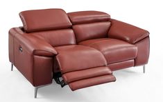 a brown leather reclining sofa sitting on top of a white floor