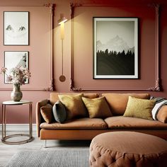 a living room filled with furniture and paintings on the wall next to a coffee table