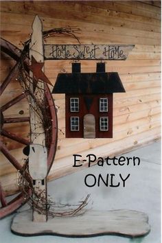 a wooden wagon wheel with a house on it and the words e - pattern only