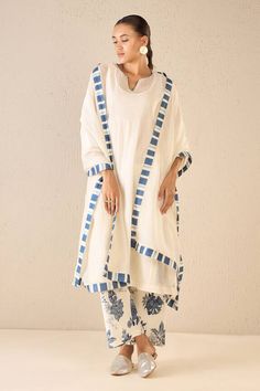 Ivory three fourth sleeves kurta with pintucked yoke detail. Paired with a floral print pant and a striped border printed dupatta. - Aza Fashions White Cotton Kurta With Printed Border, White Straight Kurta Sets With Printed Border, White Sets With Printed Border And Straight Kurta, White Straight Kurta With Printed Border, White Salwar Kameez With Printed Border, White Kurta With Printed Border For Eid, Eid White Kurta With Printed Border, White Sets With Printed Border For Spring, V Flower