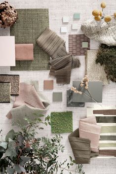 the wall is covered in many different shades of green and beiges, including neutral colors