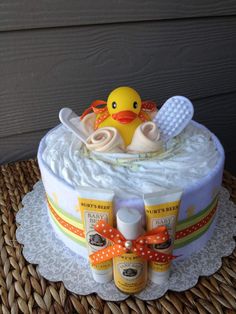 a baby shower cake with a rubber ducky on top