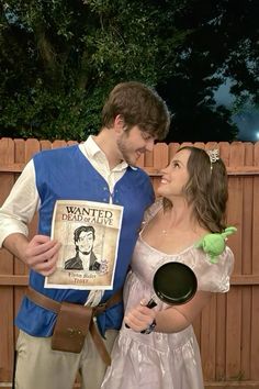 a man and woman dressed up as characters from disney's beauty and the beast