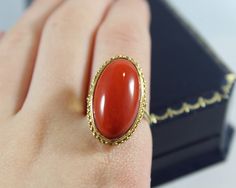 -Vintage 18k Gold Long Oval Shape Natural Red Italian Coral Ring -Ring size: 7 US -Coral size: 22.15 mm x 12 mm -Total weight: 7 g -Marked 750 -The coral have little bit of flaw on the side Red Oval Cabochon Signet Ring For Formal Occasions, Formal Oval Ruby Ring, Luxury Red Oval Signet Ring, Coral Bracelet, Coral Ring, Coral Earrings, Coral Beads, Strand Bracelet, New City