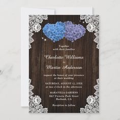 the rustic wood and lace wedding card features blue hydranges on it, along with white lace