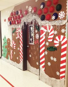 an office decorated for christmas with gingerbreads and candy canes on the doors