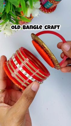 someone is holding some bangles in their hand and the other one has a ring on it