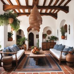 a living room filled with furniture and potted plants