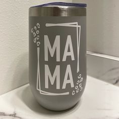 a gray tumbler sitting on top of a counter