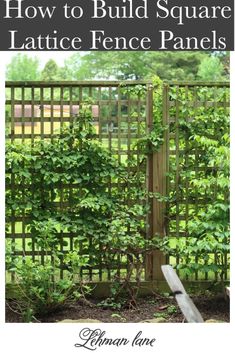 a wooden fence with vines growing on it and some rocks in the ground near by