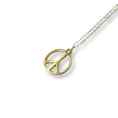 This adorable charm necklace adorns a beautiful gold peace sign pendant. Makes the perfect gift to any loved one. Dainty chain charm necklace comes packaged in cute glass vial. 18" stainless steel / non-tarnish Everyday Brass Charm Necklace Nickel Free, Everyday Nickel Free Brass Charm Necklaces, Peace Sign Jewelry For Gifts, Symbolic Peace Sign Jewelry For Gift, Gold Peace Sign Jewelry Gift, Adjustable Peace Sign Necklace As Gift, Adjustable Peace Sign Necklace, Gold Jewelry With Peace Sign For Gift, Nickel-free Brass Charm Necklace With Round Pendant