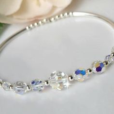 Swarovski Crystal Stretch Bangle | Etsy Silver Crystal Beaded Bracelets For Anniversary, Silver Crystal Beaded Bracelet For Anniversary, Adjustable Silver Crystal Bangle, Silver Crystal Bracelet With Faceted Beads For Wedding, Silver Beaded Crystal Bangle Bracelet, Crystal Bangle Bracelet With Silver Beads, Silver Crystal Bangle Bracelet With Faceted Beads, Silver Crystal Bangle With Faceted Beads, Pandora Charms