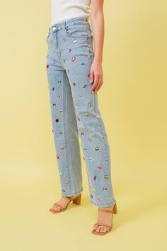 Make a statement in these multicolor embellished jeans, featuring bright bold large rhinestone colorful gems on a class mid waist design. Perfect for a unique and eye catching look. Stretchy Embellished Clothes, Bright Colored Outfits, Taylor Swift Tour Outfits, Colorful Outfits, Denim And Diamonds, Maxi Romper, Crop Top Sweatshirt, Embellished Denim, Embellished Jeans