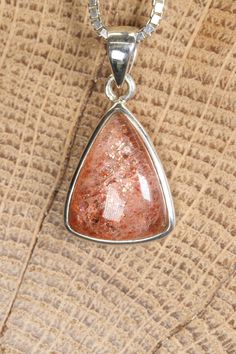 Sunstone Pendant Approx. Dimensions: 22x20x6 mm This pendant is made with .925 Sterling Silver. Chain is not included. Sunstone is a beautiful and unique feldspar mineral known for its shimmering and sparkling appearance. It belongs to the same mineral family as moonstone and labradorite, and it's valued for its warm colors and intriguing optical effects. Sunstone is primarily composed of a variety of feldspar known as oligoclase, often with the presence of hematite or goethite inclusions that c Silver Sunstone Jewelry As A Gift, Silver Sunstone Jewelry For Gift, Sunstone Gemstone For Jewelry Making, Sunstone Gemstone Jewelry As Gift, Sunstone Gemstone Jewelry For Jewelry Making, Silver Sunstone Jewelry With Gemstone, Spiritual Sunstone Jewelry As A Gift, Spiritual Sunstone Jewelry For Gift, Silver Mineral Crystal Gemstones As Gifts