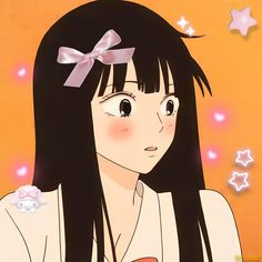 a girl with long black hair and a bow in her hair