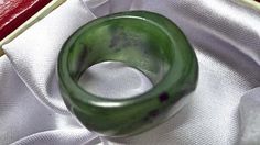 Size 10 Nephrite jade saddle ring. S339 Modern Green Emerald Ring, Elegant Untreated Green Emerald Ring, Modern Green Ring With Large Stone, Green Ring With Large Stone, Unique Round Jade Ring, Carved Jade Rings As A Gift, Spiritual Green Jade Rings, Gold Jade Ring With Polished Finish, Classic Jade Rings With Polished Finish