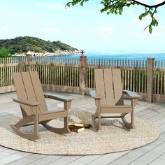 two rocking chairs sitting on top of a wooden deck