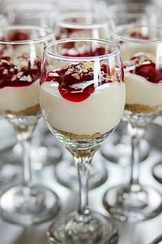 three desserts in wine glasses with garnishes on the top and bottom