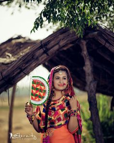 a woman in an orange dress holding a piece of fruit