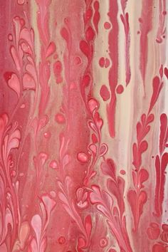 an abstract painting with red and pink colors