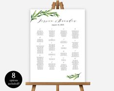 the seating chart for an event with greenery on it, is shown in front of a easel