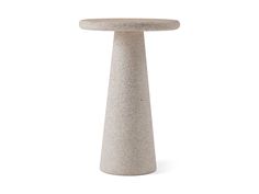 a concrete table with a white background