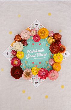 a colorful flower wreath with the words celebrate good times on it