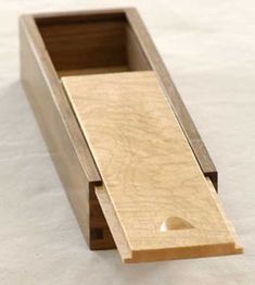 a wooden box with a hole in it