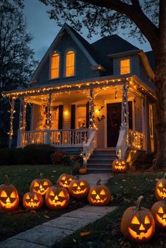 pumpkins lit up in front of a house at night