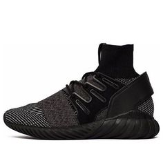 The Adidas Tubular Doom PK 'Core Black' is a stylish and modern take on a classic sneaker. The Primeknit upper in a two-tone geometric pattern is combined with a sock-like bootie that hugs the ankle for a comfortable and supportive fit. The iconic Three-Stripes are translated into a lateral cage and laced up in black. The forward-facing pull tab and counter add subtle branding to this already stand-out sneaker. The Tubular sole offers support and style in one package. (SNKR/Unisex) Adidas Tubular Doom, Adidas Tubular, Classic Sneakers, Pull Tab, Stylish Sneakers, Bootie, Perfect Pair, Two Tone, Geometric Pattern