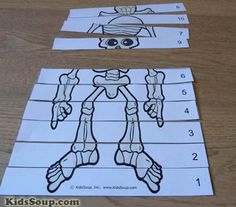 the parts of a robot cut out from paper