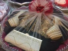 the purse is covered with pearls and tulle, along with several other items that are on display