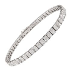 Stunning modern straight radiant cut diamond tennis bracelet. High jewelry by Alexander Beverly Hills. 54 radiant cut diamonds, 9.54 carats. Approximately G color and VS2 clarity. 18k white gold, 10.53 grams, 7in. Accommodated with an up-to-date digital appraisal by a GIA G.G. once purchased, upon request. Please contact us with any questions. Item Number BS1389 10 Carat Tennis Bracelet, Bracelet Tennis, Diamond Tennis Bracelet, American Modern, Radiant Cut Diamond, Radiant Diamond, Tennis Bracelet Diamond, Radiant Cut, High Jewelry